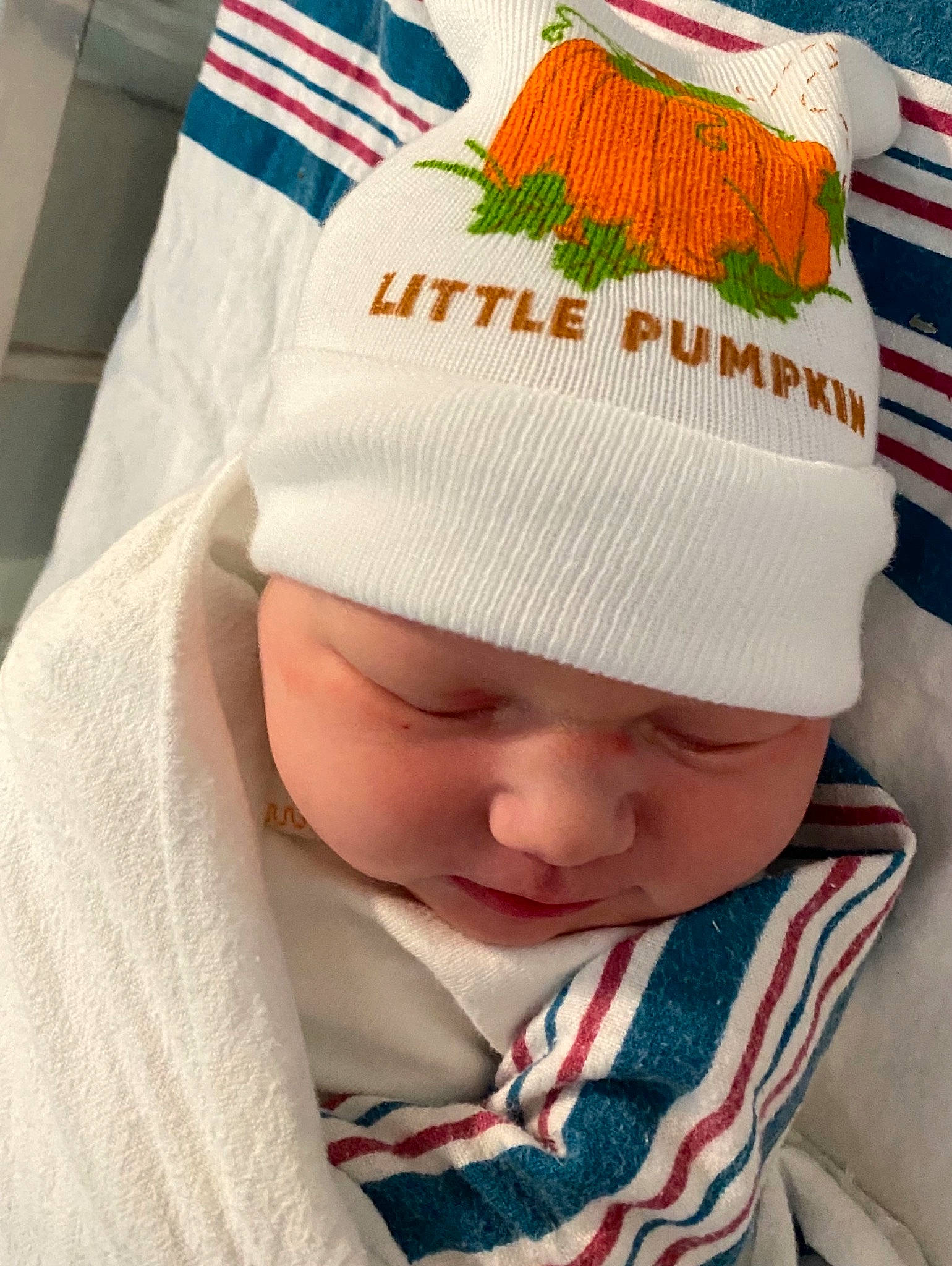 Adeline is registered to the contest to win money with this photo: baby, baby_products, baby_toddler_clothing, beanie, bonnet, cap, child, comfort, fashion_accessory, headgear, headwear, knit_cap, knitting, linens, pattern, person, textile, toddler, white, wool