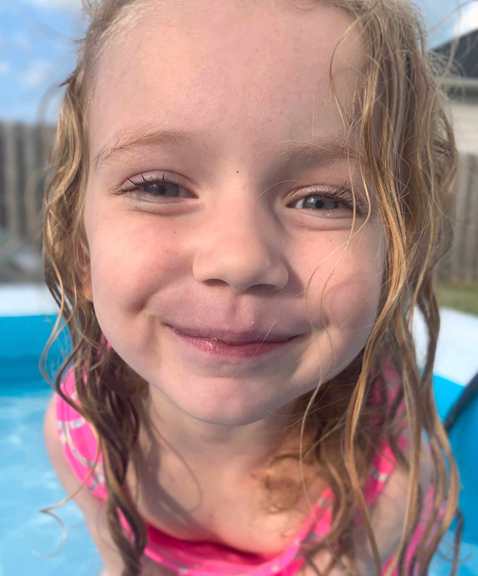 Charlee Grace is registered to the contest to win money with this photo: child, clothing, face, female, girl, happy, head, leisureactivities, person, photography, pool, portrait, smile, sport, summer, swimming, swimmingpool, swimwear, water, watersports