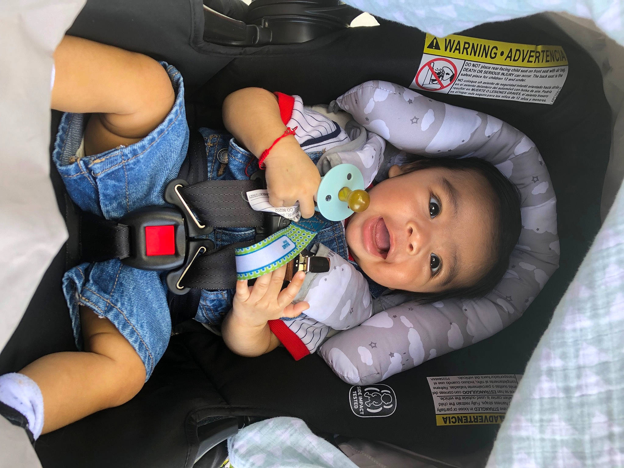 Mathias is registered to the contest to win money with this photo: auto_part, baby, baby_carriage, baby_in_car_seat, baby_products, baby_toddler_clothing, bag, car_seat, child, comfort, family_car, fun, human_leg, lap, luggage_and_bags, person, shorts, smile, thigh, toddler