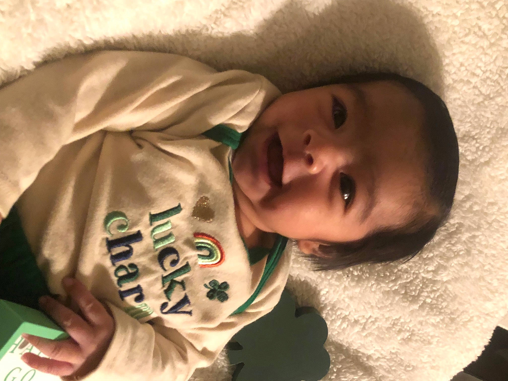 Mathias is registered to the contest to win money with this photo: baby, baby_toddler_clothing, cheek, child, close_up, comfort, eyebrow, facial_expression, grass, happy, mammal, mouth, nose, person, product, skin, sleeve, smile, toddler, vertebrate