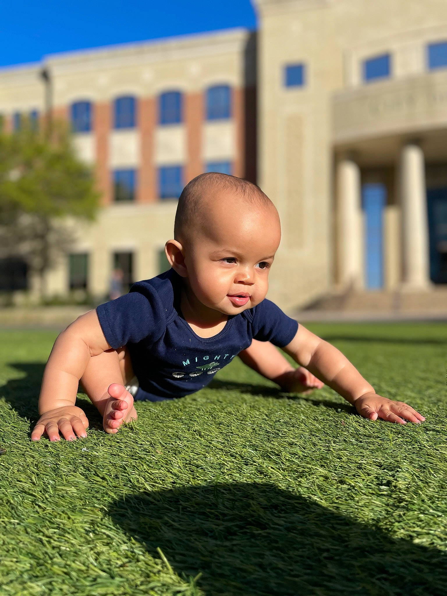 Onyx is registered to the contest to win money with this photo: baby, baby_toddler_clothing, child, crawling, flooring, grass, grass_family, grassland, groundcover, happy, lawn, leisure, people, people_in_nature, person, plant, recreation, sky, t_shirt, toddler
