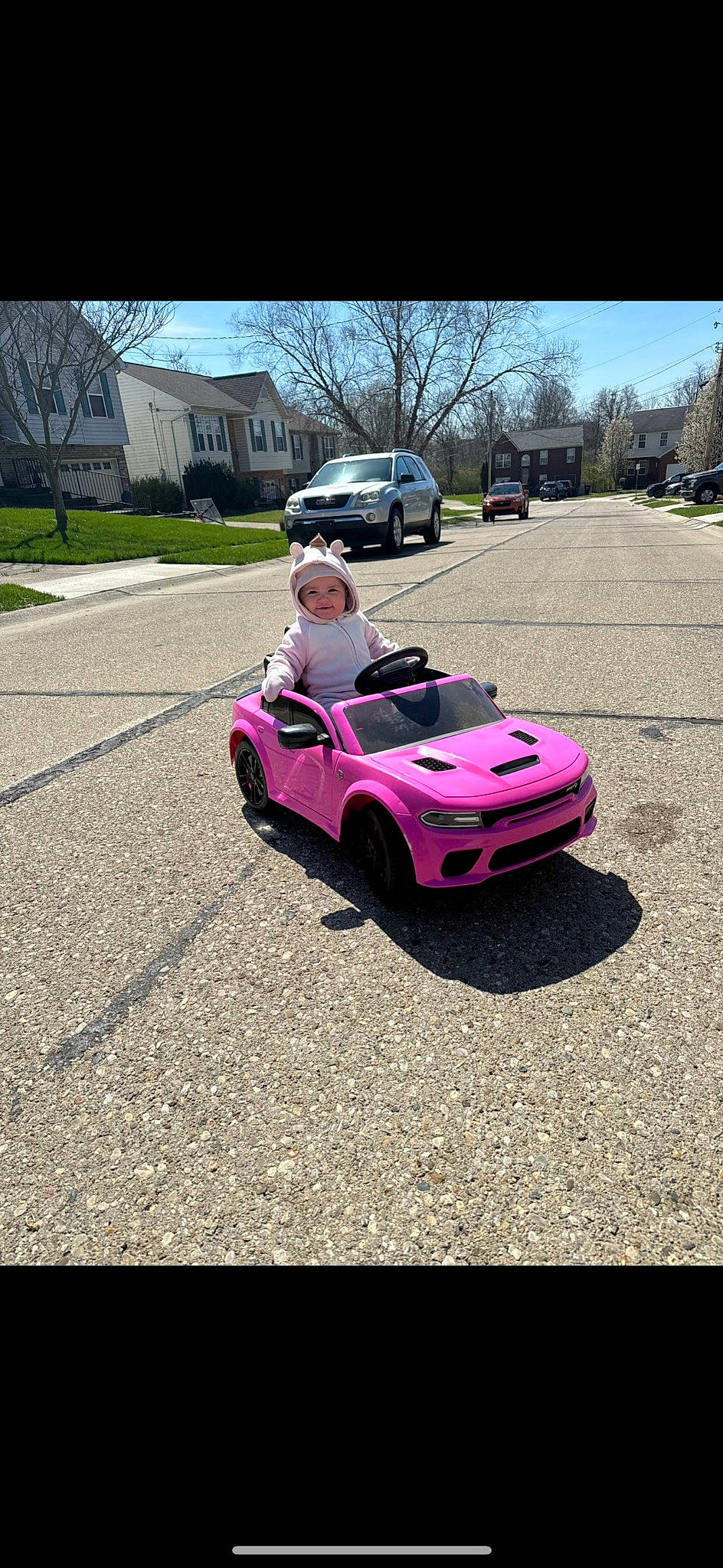 Amiyah joined the competition — help win amazing prizes! alloy_wheel, asphalt, automotive_design, automotive_lighting, automotive_tire, bumper, car, fender, headwear, hood, land_vehicle, motor_vehicle, person, personal_luxury_car, plant, sky, tire, tree, vehicle, vehicle_door
