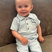 Kairo joined the competition — help win amazing prizes! baby, child, smiling, sitting, couch, clothing, light_blue, ribbed_fabric, happy, indoor, portrait, cute, person, small_child, furniture, casual_wear, buttoned_shirt, hand, face, cozy