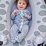 Loan participe au concours pour gagner de l'argent avec cette photo : baby, infant, striped_clothing, onesie, inflatable_float, playful, grass, outdoor, child, smiling, happy, toy, blue_eyes, cute, young, relaxed, casual, fun, summer, nature