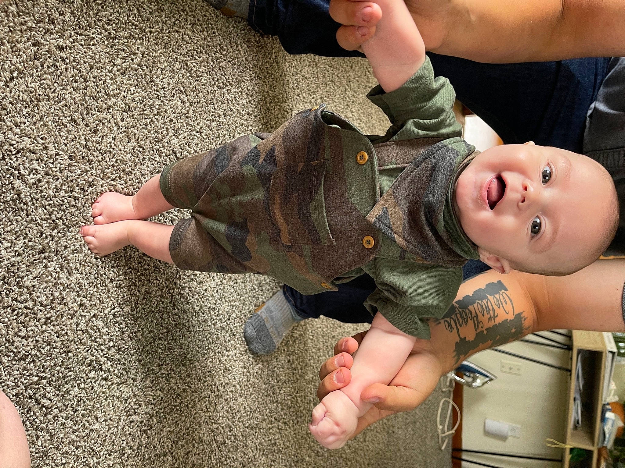 Branson joined the competition — help win amazing prizes! arm, baby, barefoot, finger, flash_photography, flooring, foot, fun, gesture, grass, hand, happy, human_leg, joint, leg, person, skin, thigh, thumb, toddler