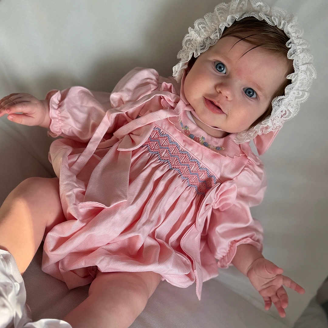 Ivy joined the competition — help win amazing prizes! accessories, baby, bodypart, bonnet, cap, clothing, costume, dress, face, finger, furniture, hand, hat, head, jewelry, necklace, person, photography, portrait, sitting