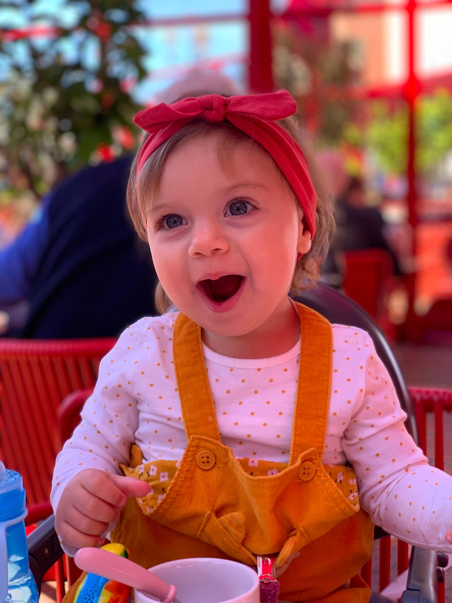 Elisa participe au concours pour gagner de l'argent avec cette photo : baby, baby_toddler_clothing, cap, child, cup, event, fashion_accessory, fun, happy, headwear, leisure, orange, person, photograph, pink, recreation, sitting, skin, smile, summer