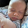 Finnick joined the competition — help win amazing prizes! baby, sleeping, infant, face, arm, clothing, pattern, bird_pattern, blanket, floral, closeup, peaceful, skin, newborn, cute, child, portrait, soft, resting, cozy
