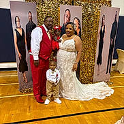 Jamie Cosley joined the competition — help win amazing prizes! family, wedding, formal_clothing, child, toddler, baby, portrait, gold_backdrop, gymnasium, flooring, smile, happy, celebration, dress, suit, tie, shoes, indoor, event, people