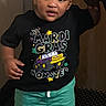 Jamie Cosley joined the competition — help win amazing prizes! toddler, child, standing, holding_hand, black_tshirt, green_shorts, sneakers, indoor, carpet, door, person, cute, smiling, young_child, footwear, hand, adult, fashion, portrait, casual_clothing