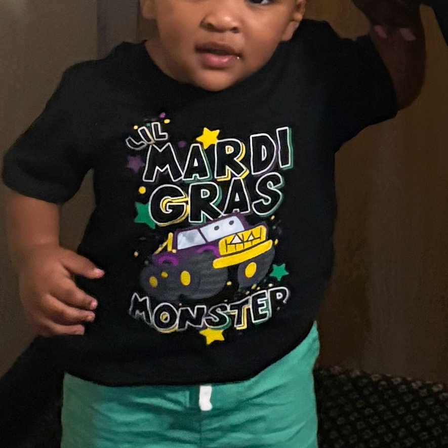 Jamie Cosley joined the competition — help win amazing prizes! toddler, child, standing, holding_hand, black_tshirt, green_shorts, sneakers, indoor, carpet, door, person, cute, smiling, young_child, footwear, hand, adult, fashion, portrait, casual_clothing
