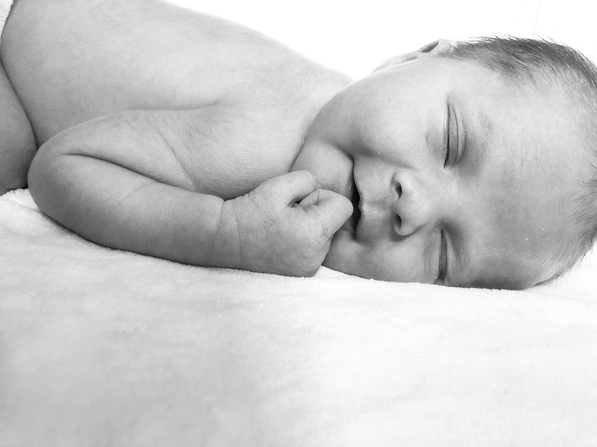 Hattie is registered to the contest to win money with this photo: baby, baby_sleeping, black_and_white, child, comfort, face, hand, head, lip, love, monochrome, person, photograph, photography, portrait_photography, skin, sleep, stock_photography, toddler, tummy_time