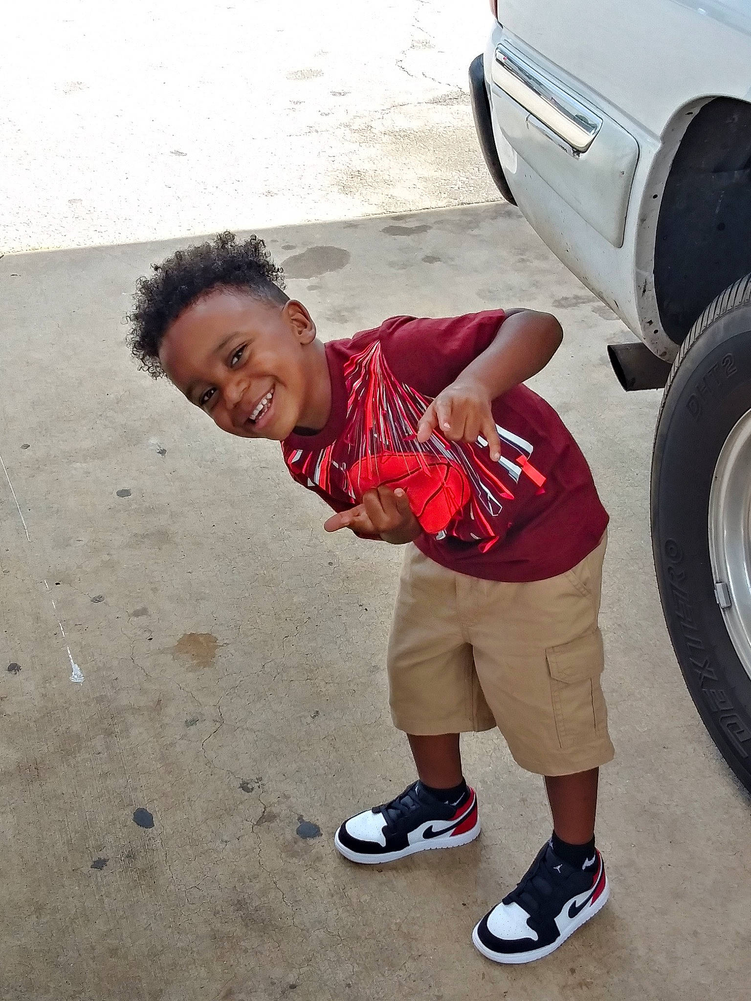 Zymere is registered to the contest to win money with this photo: auto_part, automotive_design, automotive_tire, automotive_wheel_system, car, child, family_car, fender, fun, joy, male, motor_vehicle, person, red, rim, tire, tire_care, toddler, vacation, vehicle