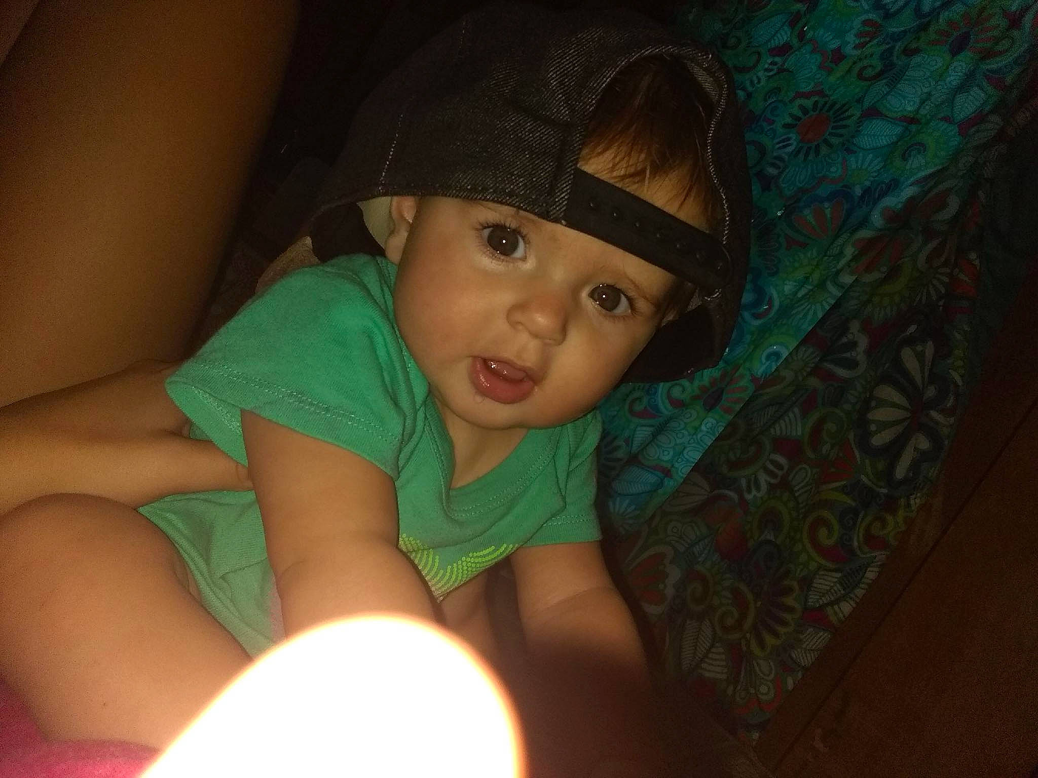 Natalie is registered to the contest to win money with this photo: abdomen, black_hair, cheek, child, cool, eye, face, finger, fun, girl, green, hand, head, infant, iris, mouth, nose, person, skin, smile