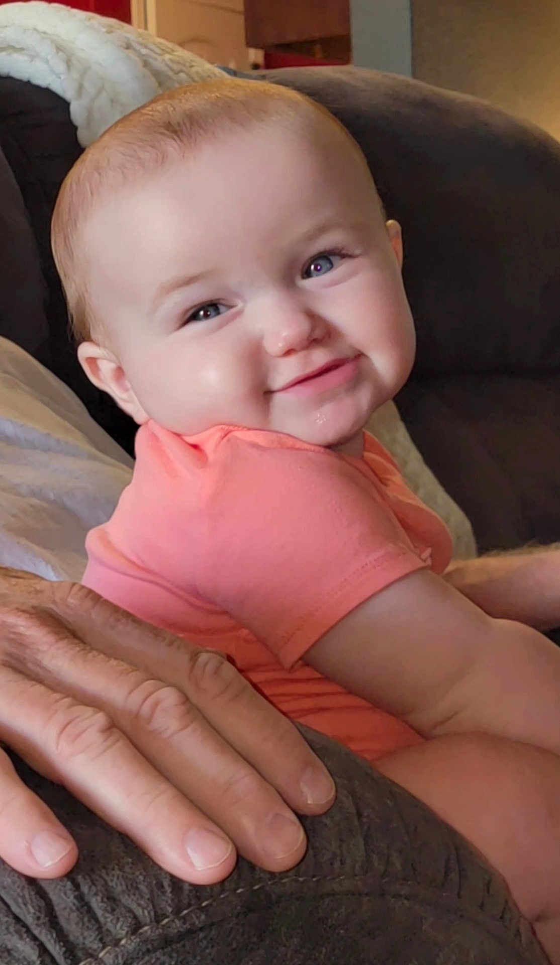 Laney Dru is registered to the contest to win money with this photo: baby, child, smile, face, hand, couch, blanket, indoors, person, infant, cute, happy, skin, clothing, seated, portrait, young, family, comfort, closeup