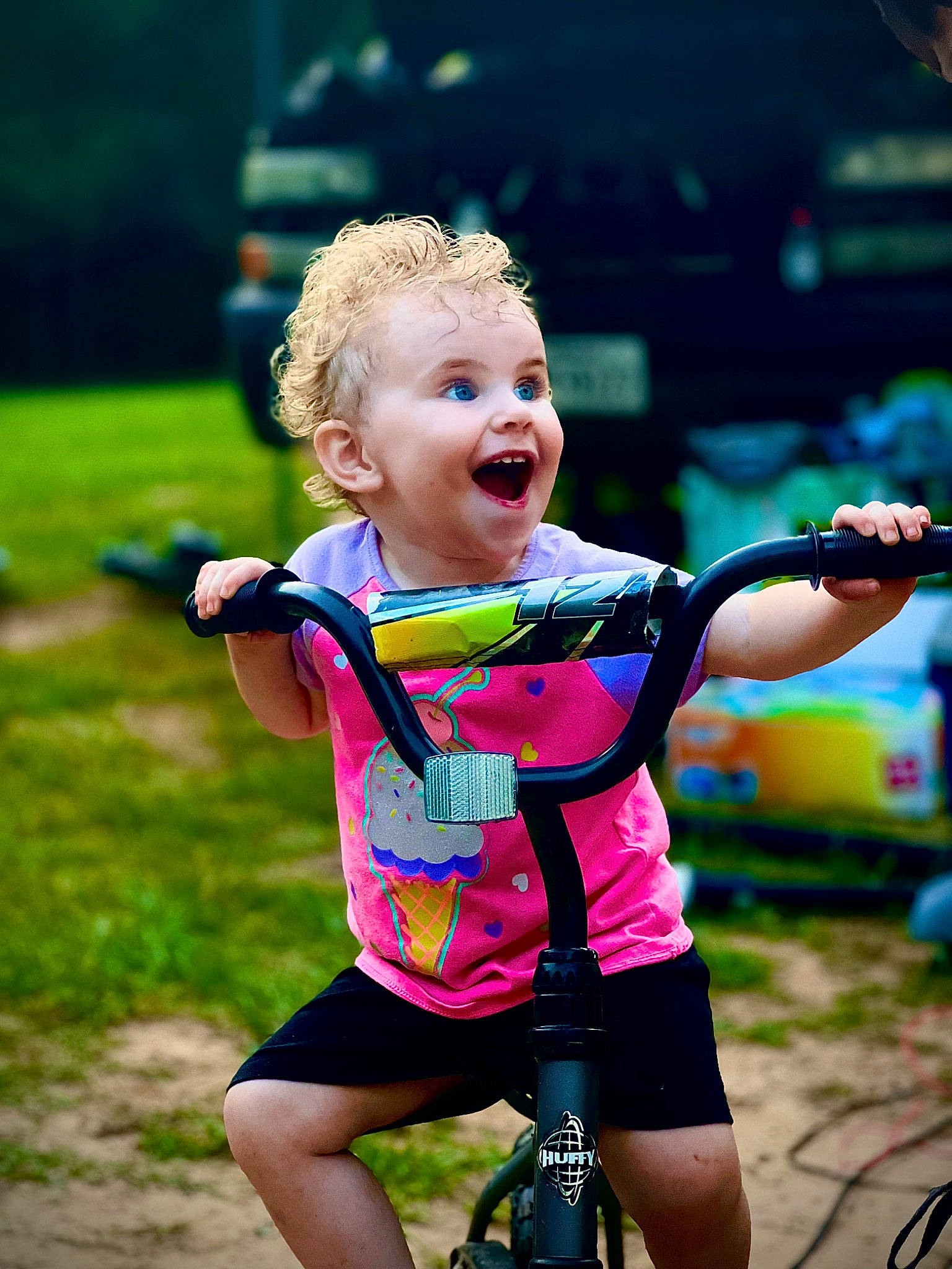 Astrid is registered to the contest to win money with this photo: bicycle_clothing, bicycle_frame, bicycle_handlebar, bicycle_tire, bicycles_equipment_and_supplies, child, cycle_sport, cycling, fun, grass, happy, leisure, magenta, person, personal_protective_equipment, recreation, smile, sportswear, summer, surprise