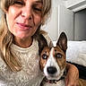 Magnum a rejoint le concours — aidez-le/la à gagner de superbes lots ! woman, dog, indoor, portrait, smile, pet, furniture, blanket, door, wall, clothing, person, face, animal, home, lap, candid, cute, ear, collar