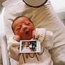 Tate joined the competition — help win amazing prizes! baby, bassinet, cozy, cute, family, foot, hand, hospital, infant, knitted_sweater, lying_down, newborn, person, photo, portrait, ring, soft, tender, warm, white