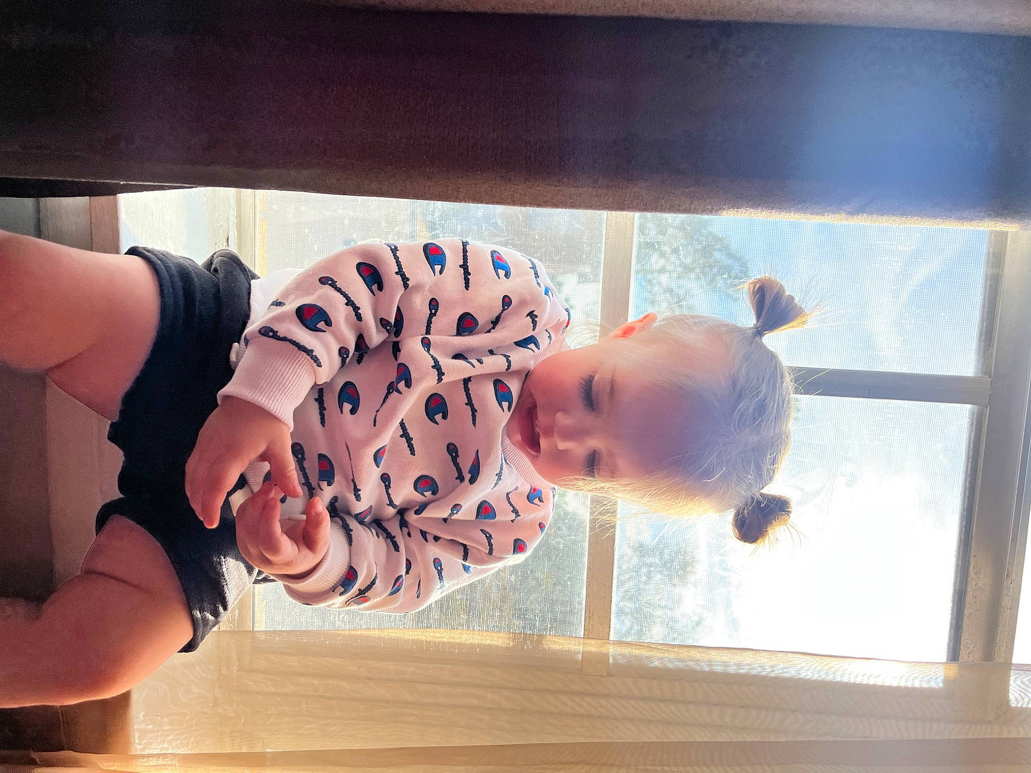Mazikeen is registered to the contest to win money with this photo: abdomen, baby, baby_toddler_clothing, child, elbow, flooring, fun, happy, human_leg, person, room, sleeve, smile, thigh, thumb, toddler, water, window, wood, wrist