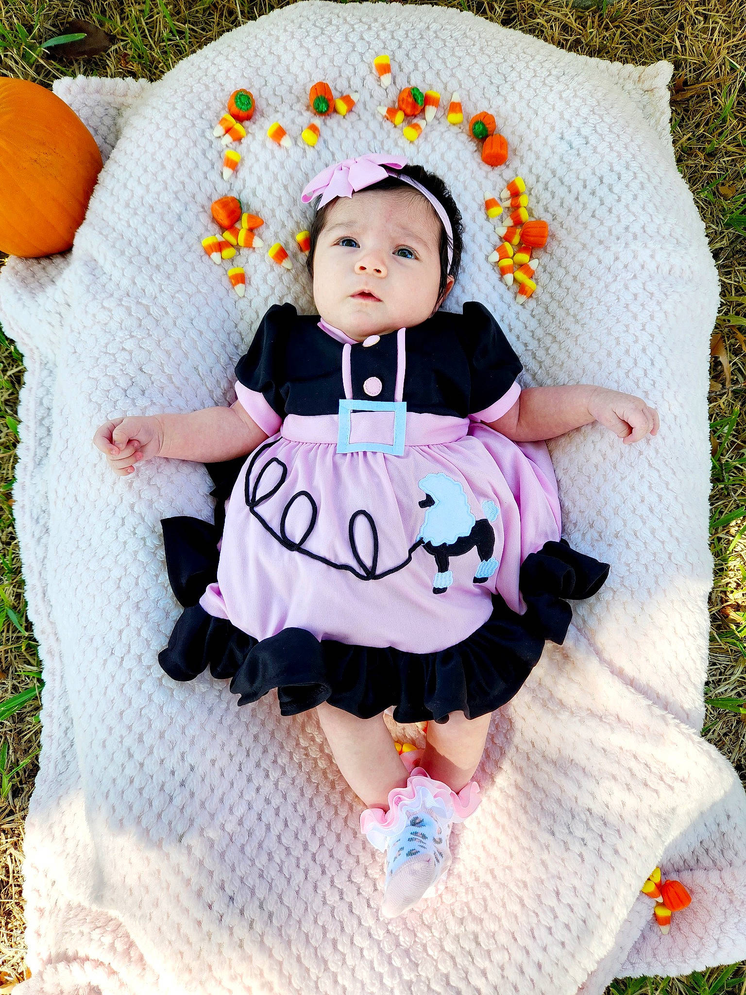 Lola joined the competition — help win amazing prizes! baby, baby_products, baby_toddler_clothing, chair, child, comfort, couch, dress, eye, grass, happy, headwear, linens, magenta, pattern, person, pink, purple, sitting, sleeve