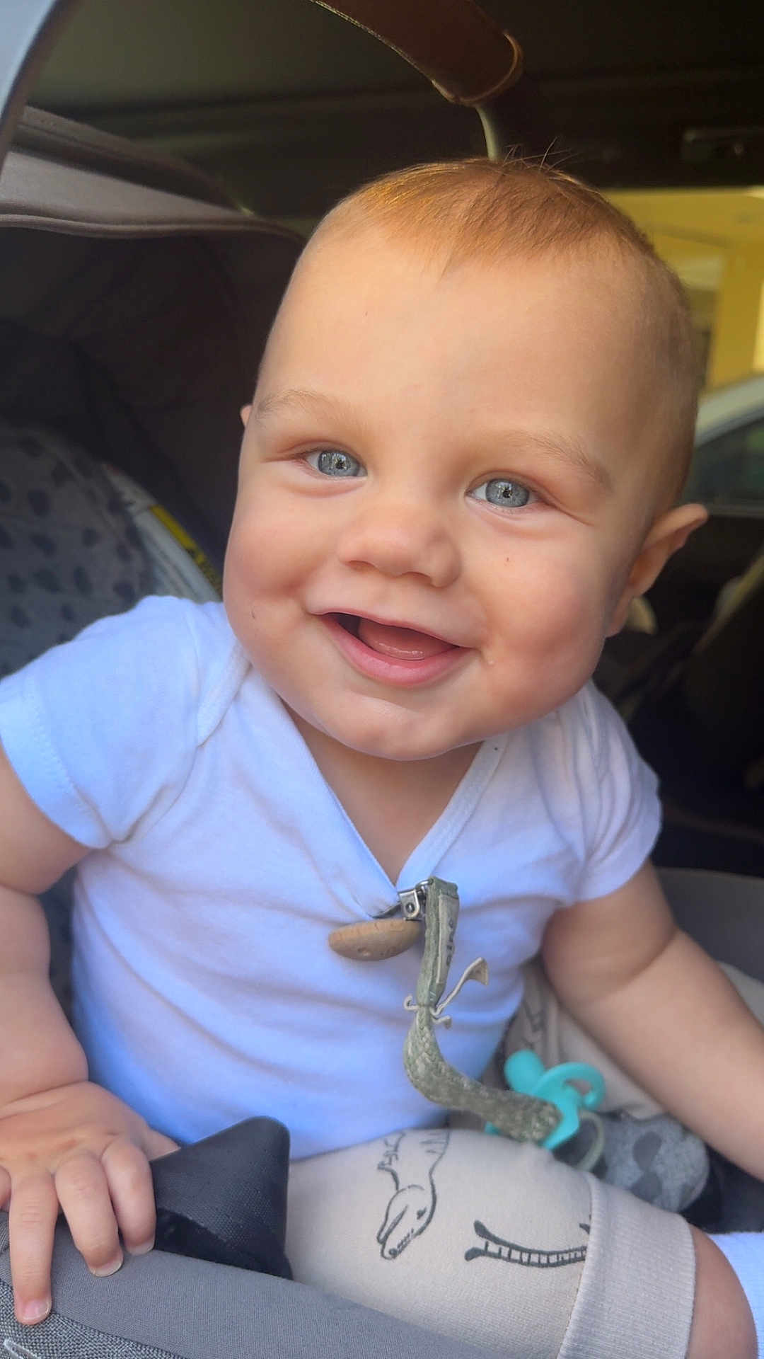 Jace joined the competition — help win amazing prizes! baby, smiling_baby, blue_eyes, onesie, car_seat, stroller, pacifier, pacifier_clip, chubby_cheeks, infant, close_up, portrait, hand, happy, cute, seat, fabric_pattern, sunlit, mouth_open, skin