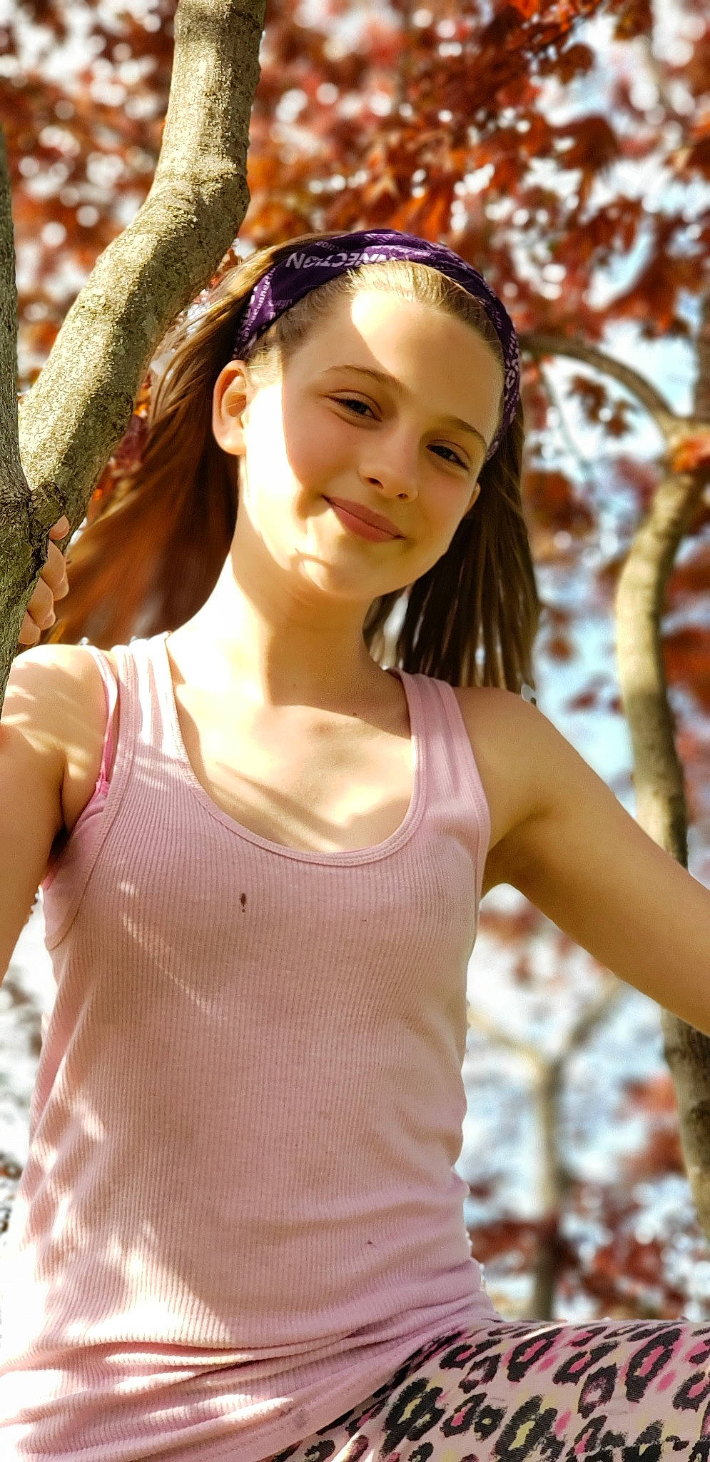 Madison is registered to the contest to win money with this photo: beauty, brown_hair, child, child_model, fawn, hair_accessory, headband, lady, long_hair, person, photo_shoot, photography, plant, smile, sunlight, tree