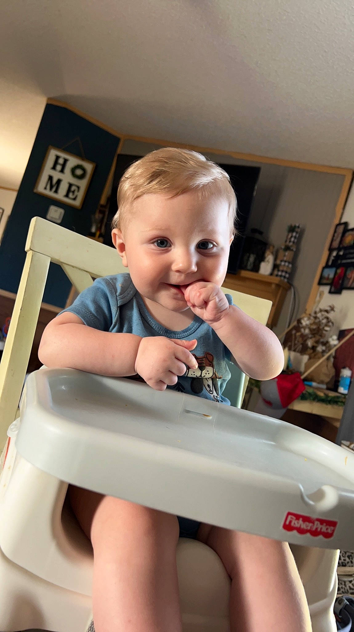 Colton joined the competition — help win amazing prizes! baby, baby_toddler_clothing, bookcase, cheek, child, elbow, finger, fun, happy, head, human_leg, joy, nail, person, room, shelf, sitting, skin, smile, t_shirt