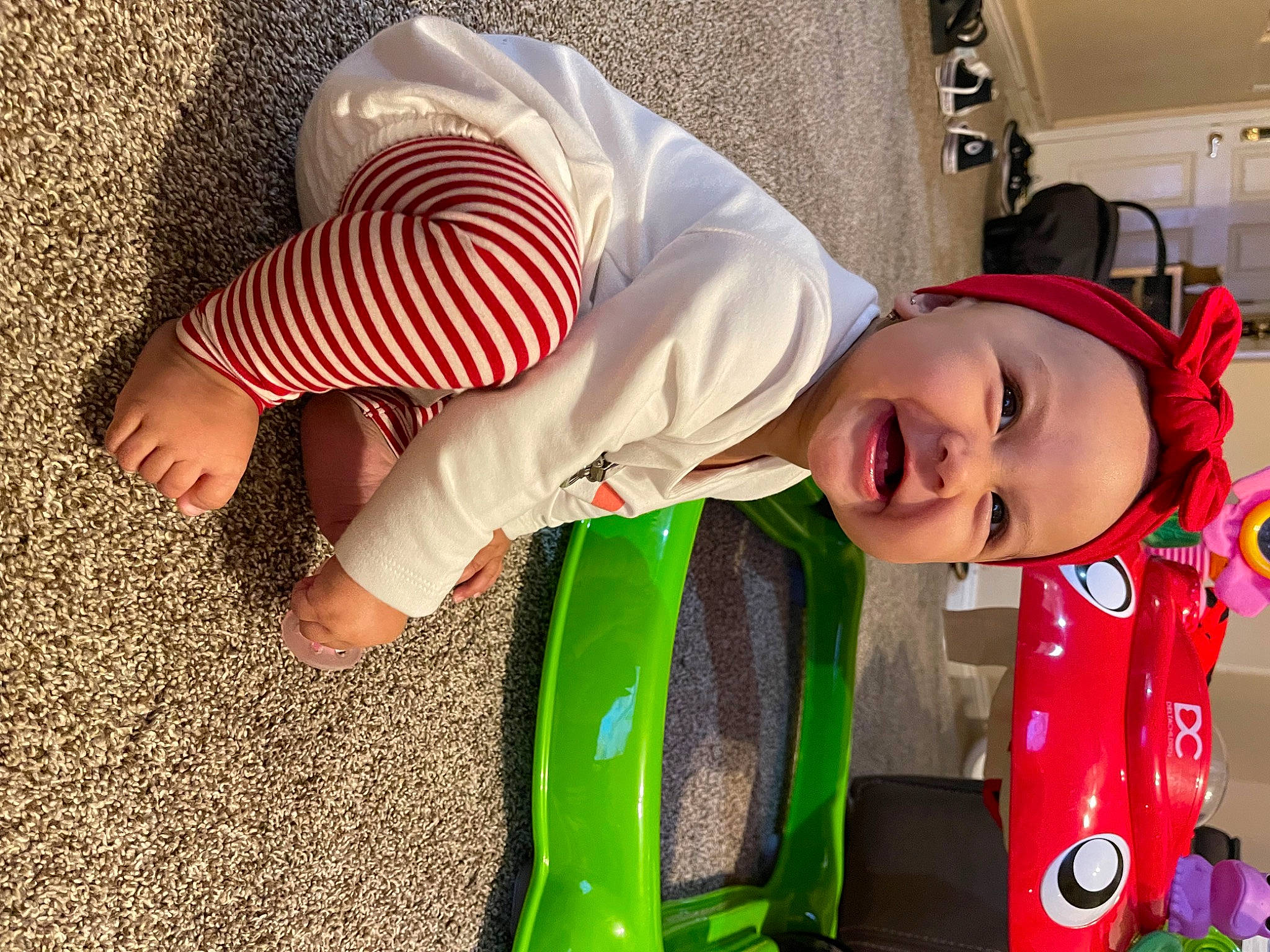 Kallie joined the competition — help win amazing prizes! baby, baby_products, baby_toddler_clothing, child, foot, fun, grass, happy, hat, headwear, human_leg, leisure, magenta, pattern, person, play, sleeve, smile, toddler, toy
