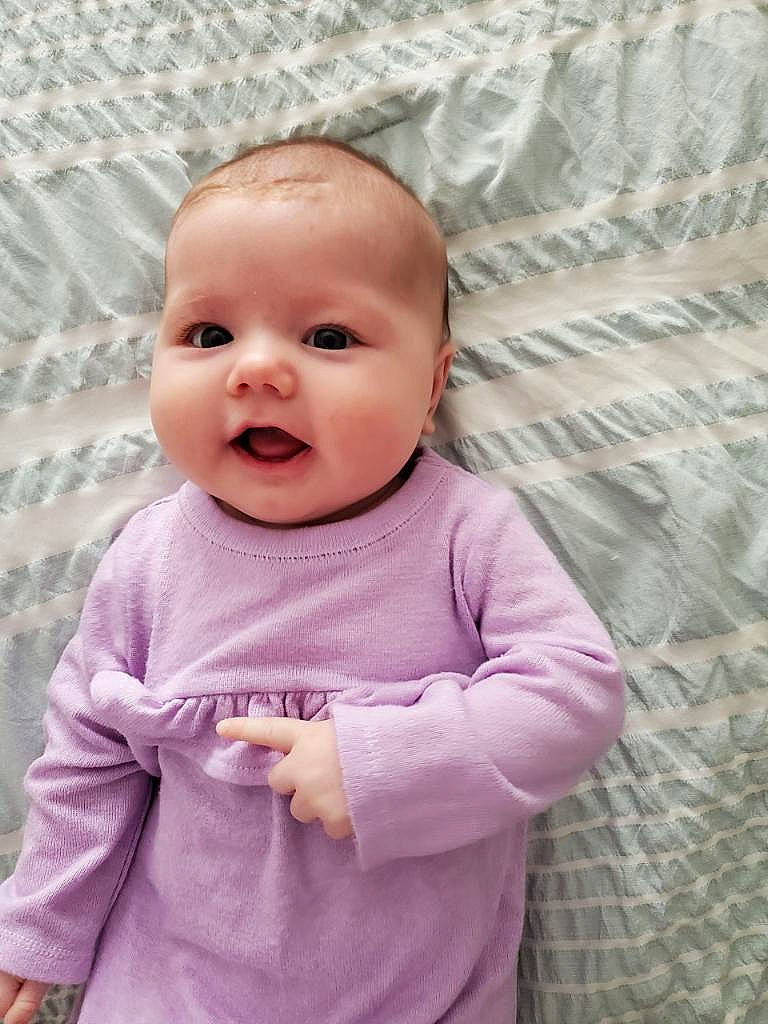 Raelynn joined the competition — help win amazing prizes! baby, baby_toddler_clothing, cheek, chin, clothing, eye, face, gesture, hairstyle, happy, head, lip, nose, outerwear, person, pink, purple, skin, sleeve, smile