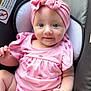 Melody is registered to the contest to win money with this photo: baby, infant, child, headband, bow, pink_clothing, watermelon_print, onesie, car_seat, seat_cushion, blue_eyes, smile, face, hands, legs, closeup, portrait, soft_lighting, cute, seat_warning_label