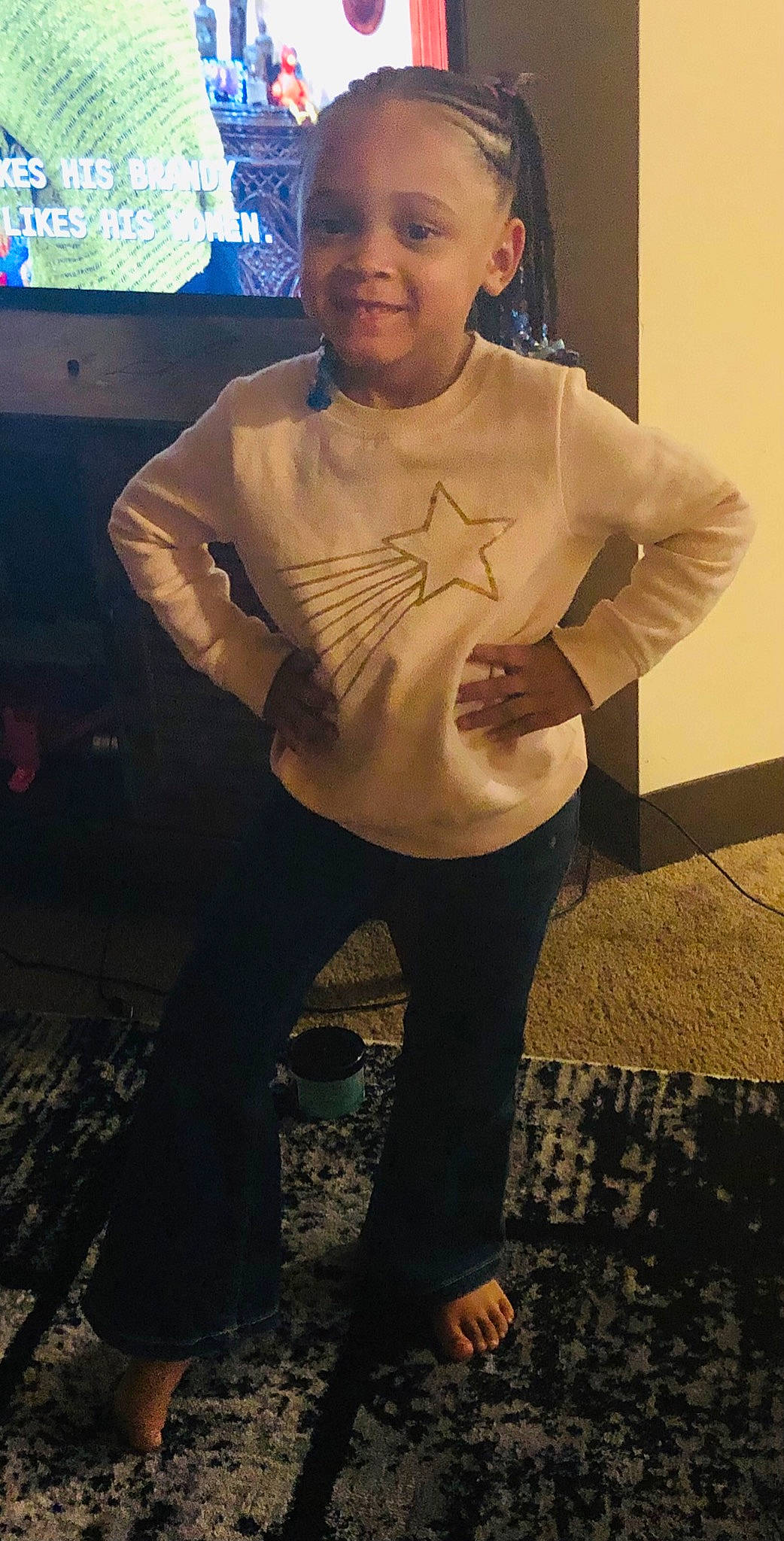 Marlynn is registered to the contest to win money with this photo: chest, elbow, flash_photography, fun, happy, human_body, human_leg, joy, knee, long_sleeved_t_shirt, neck, person, sleeve, smile, sportswear, t_shirt, television, thigh, toddler, trunk