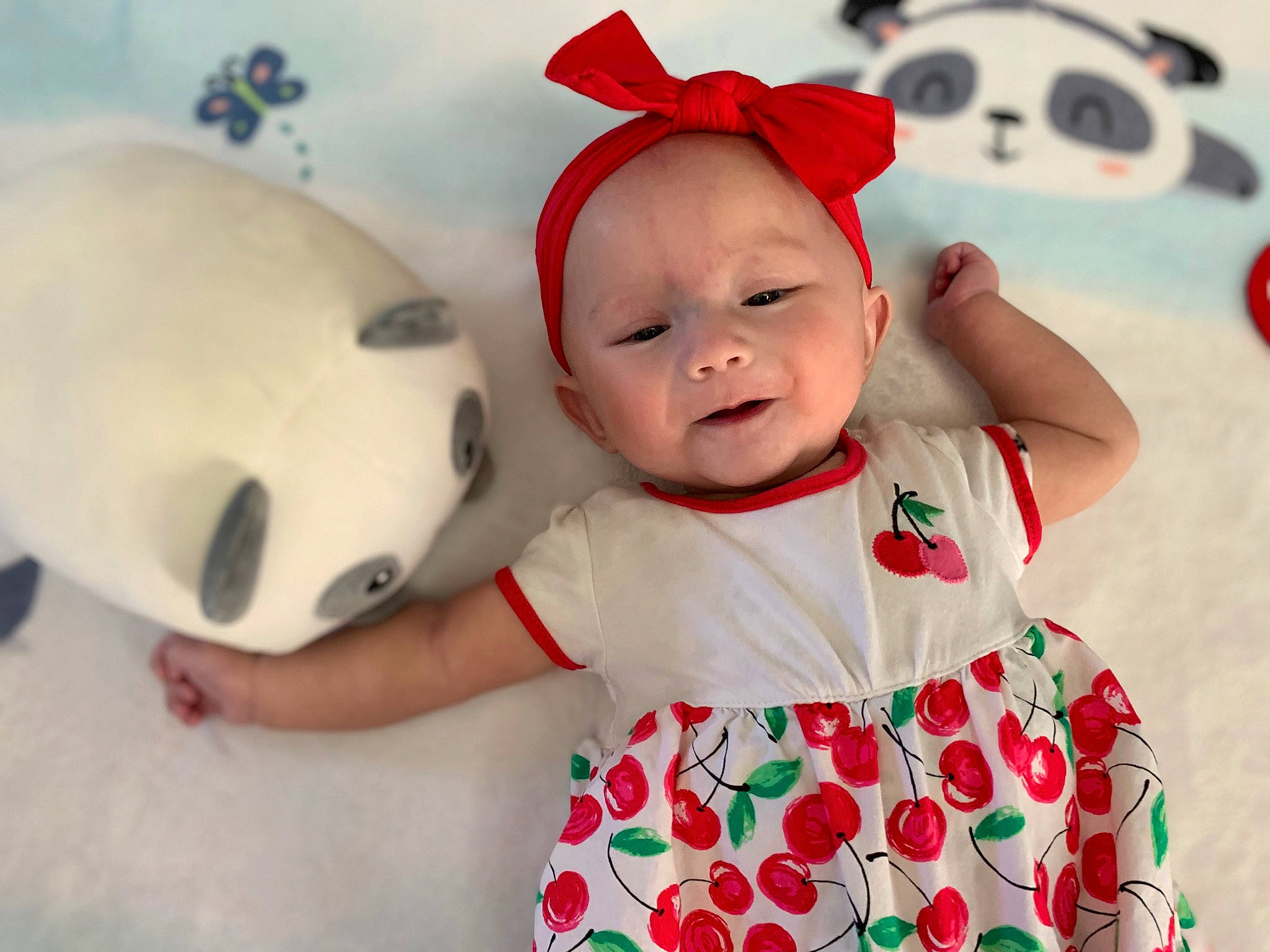 Haley is registered to the contest to win money with this photo: baby, baby_toddler_clothing, cap, dress, eye, face, facial_expression, fun, happy, head, people, person, pink, red, skin, sleeve, t_shirt, textile, toddler, toy