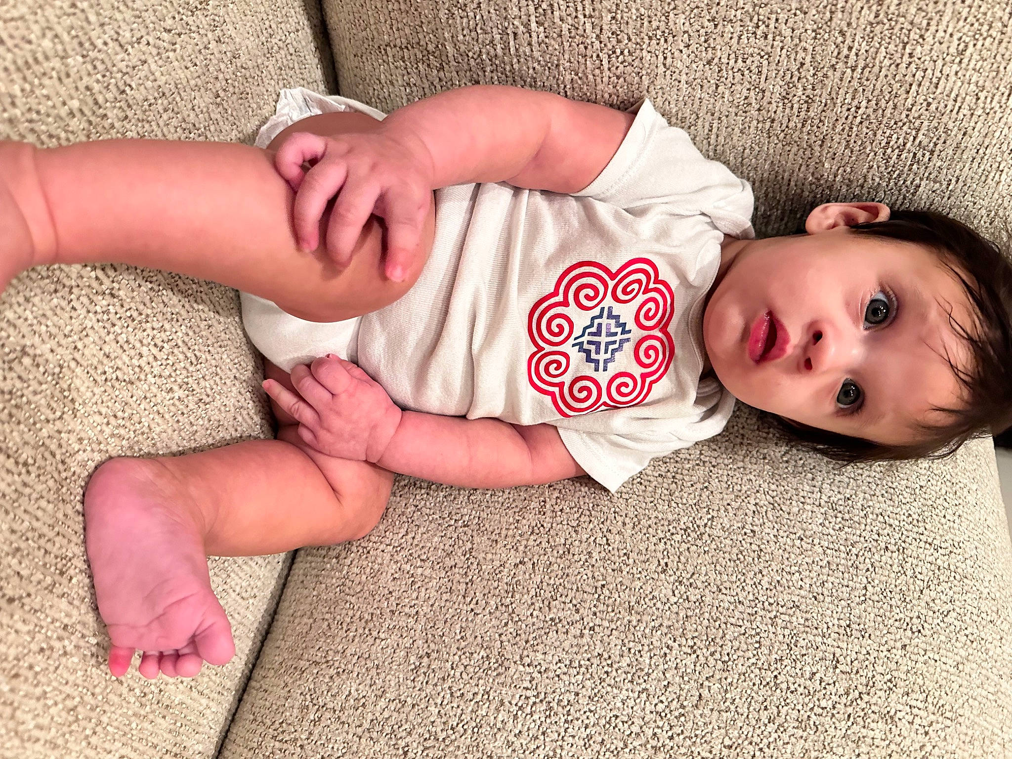 Eve joined the competition — help win amazing prizes! arm, baby, baby_toddler_clothing, comfort, finger, flooring, foot, grass, hand, human_body, joint, knee, leg, nail, neck, person, skin, sleeve, surprise, thigh