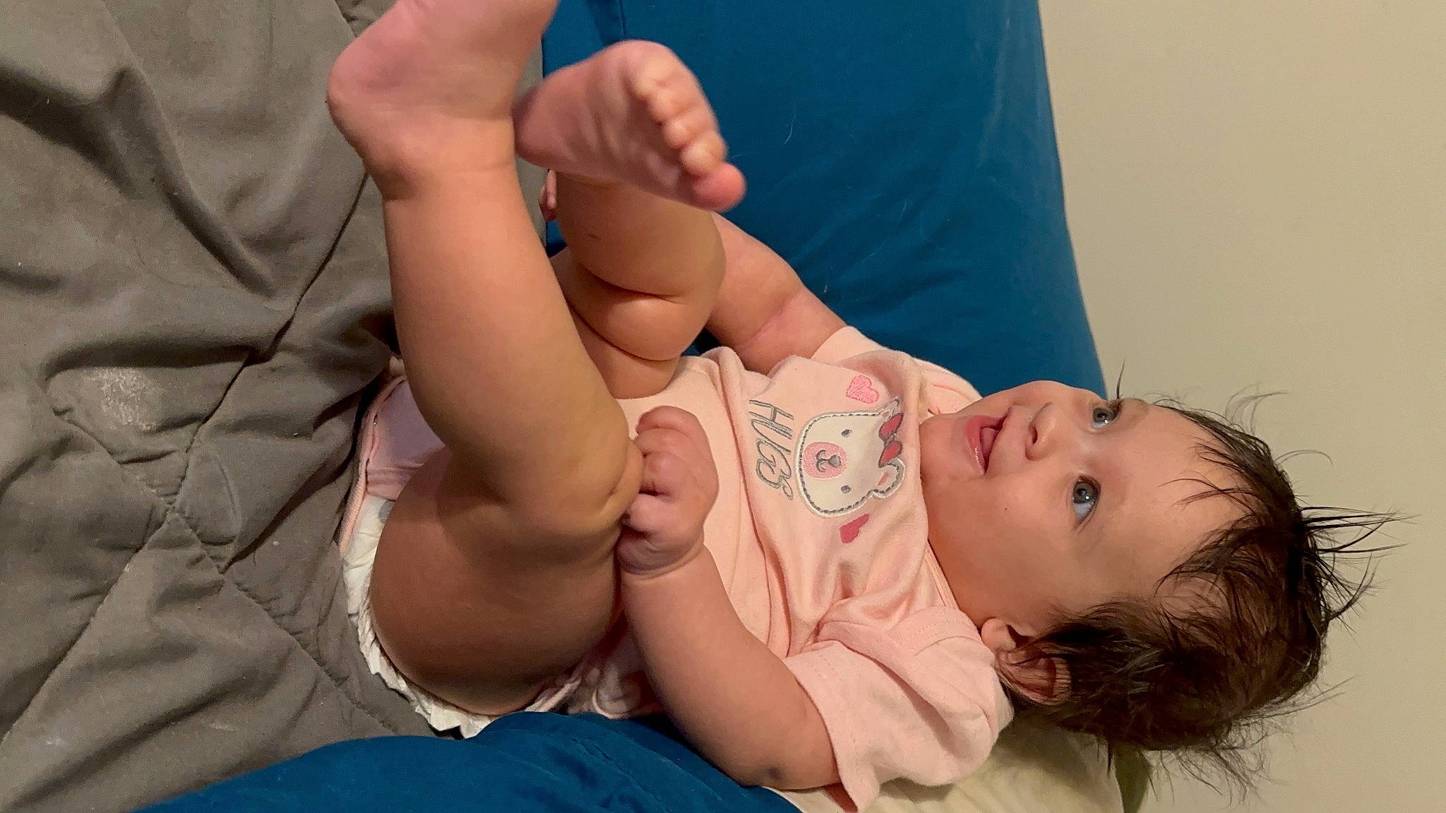 Eve is registered to the contest to win money with this photo: abdomen, baby, chest, comfort, eyelash, finger, gesture, hand, human_body, interaction, joint, leg, mouth, muscle, neck, person, shoulder, skin, stomach, thigh