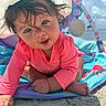baby, child, pink_clothing, hat, beach, sand, ocean, sunny, outdoor, playmat, crawling, smiling, cute, face, infant, sunhat, colorful, toy, happy, closeup