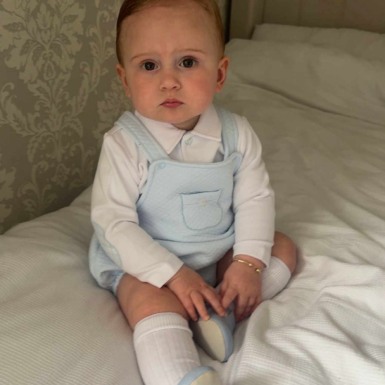 Lenny-Lee is registered to the contest to win money with this photo: baby, bed, bedroom, clothing, couch, cushion, face, footwear, furniture, head, homedecor, hosiery, indoors, pants, person, photography, portrait, room, sitting, sock