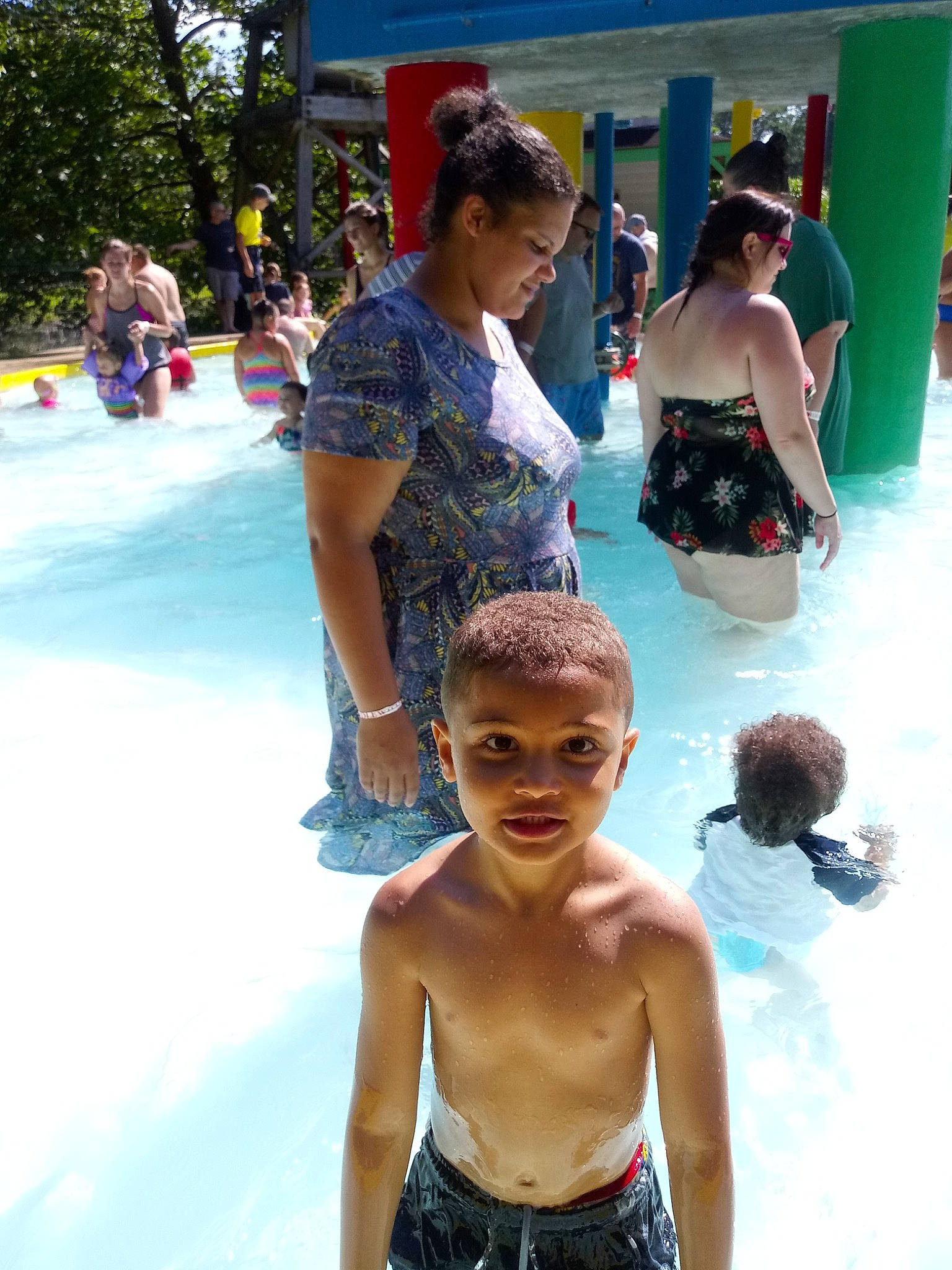 Terrance is registered to the contest to win money with this photo: amusement_park, barechested, chest, child, fun, leisure, nonbuilding_structure, park, person, recreation, smile, swimming_pool, trunk, vacation, water_park