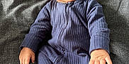 Muhammad Ali is registered to the contest to win money with this photo: baby, infant, sleeping, blue_onesie, blanket, texture, cozy, peaceful, hands, feet, portrait, child, soft_lighting, indoors, cute, newborn, relaxed, clothing, bed, resting