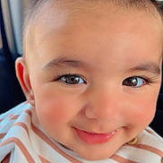 Muhammad Ali is registered to the contest to win money with this photo: adorable, baby, bright_eyes, cheerful, child, closeup, clothing, cute, face, happy, infant, innocent, knitted_patch, person, portrait, rosy_cheeks, smile, soft_lighting, striped_clothing, young_child