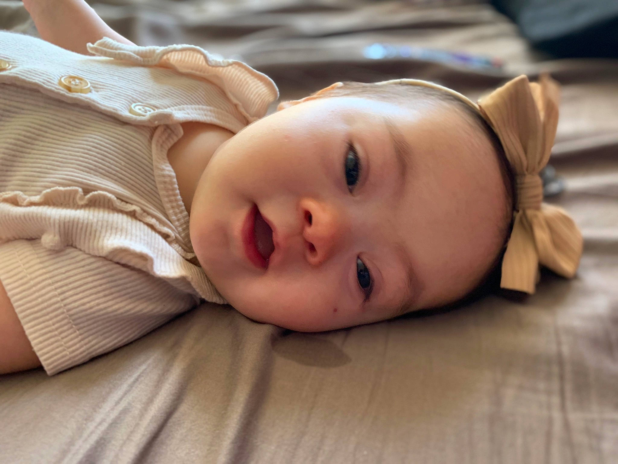 Novalea is registered to the contest to win money with this photo: baby, cheek, child, close_up, comfort, eyelash, flash_photography, flooring, fur, grass, happy, lip, neck, nose, person, sitting, skin, smile, toddler, tree