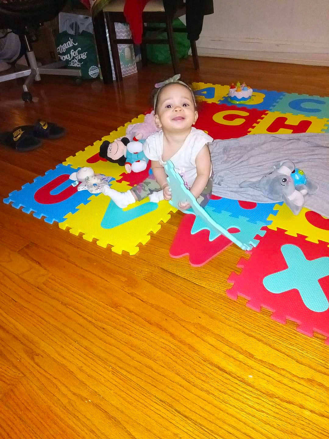 Stormy is registered to the contest to win money with this photo: baby, baby_products, baby_toys, child, educational_toy, floor, flooring, fun, hardwood, joy, laminate_flooring, leisure, person, play, toddler, toy, toy_block, toy_vehicle, varnish, wood