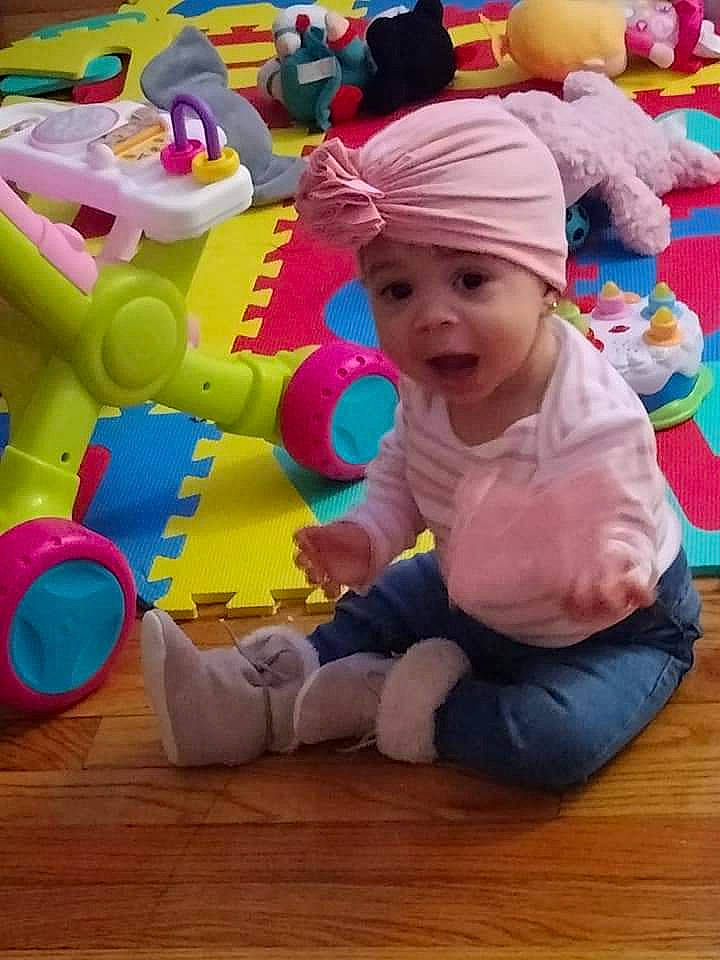 Stormy joined the competition — help win amazing prizes! baby, baby_playing_with_toys, baby_toddler_clothing, cap, child, flooring, fun, happy, hardwood, headwear, leisure, magenta, person, pink, play, product, purple, sitting, stuffed_toy, toddler