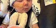 Nathan joined the competition — help win amazing prizes! baby, infant, sleeping, car_seat, nasal_tube, hat, plush_toy, bunny, child, warning_label, safety_harness, cute, resting, indoors, soft_toy, newborn, peaceful, clothing, person, face