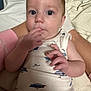 baby, infant, child, face, hand, fingers, sleeveless_shirt, boat_print, blue_eyes, skin, person, resting, soft_surface, indoors, cute, curious, young, portrait, clothing, comfort