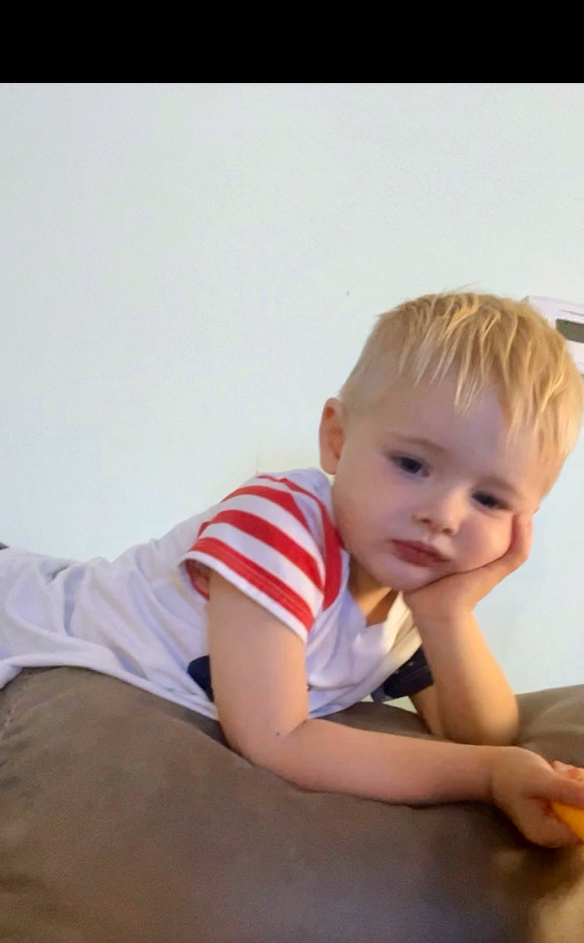 Liam is registered to the contest to win money with this photo: baby, baby_toddler_clothing, cheek, child, comfort, elbow, flash_photography, flooring, hair, happy, human_leg, knee, person, portrait_photography, sitting, skin, sleeve, smile, t_shirt, toddler