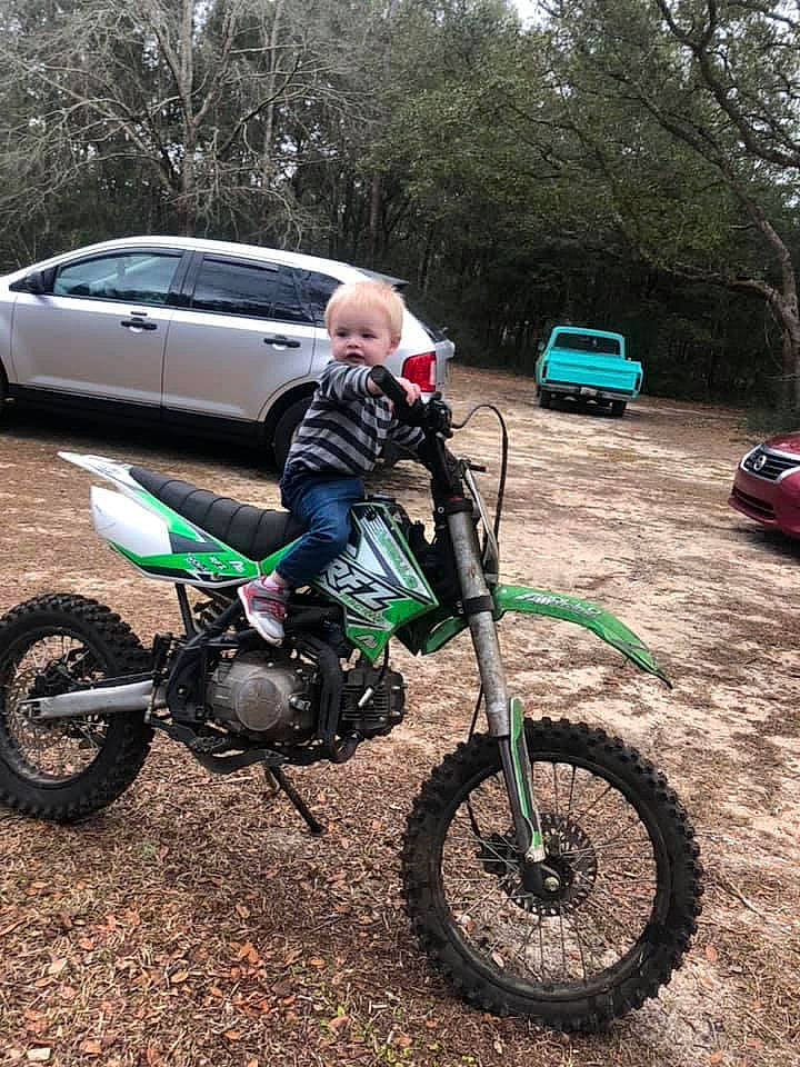 Liam joined the competition — help win amazing prizes! alloy_wheel, automotive_design, automotive_tire, automotive_wheel_system, car, fender, jeans, land_vehicle, motocross, motor_vehicle, motorcycle, motorcycling, person, plant, rim, rolling, tire, tread, tree, vehicle