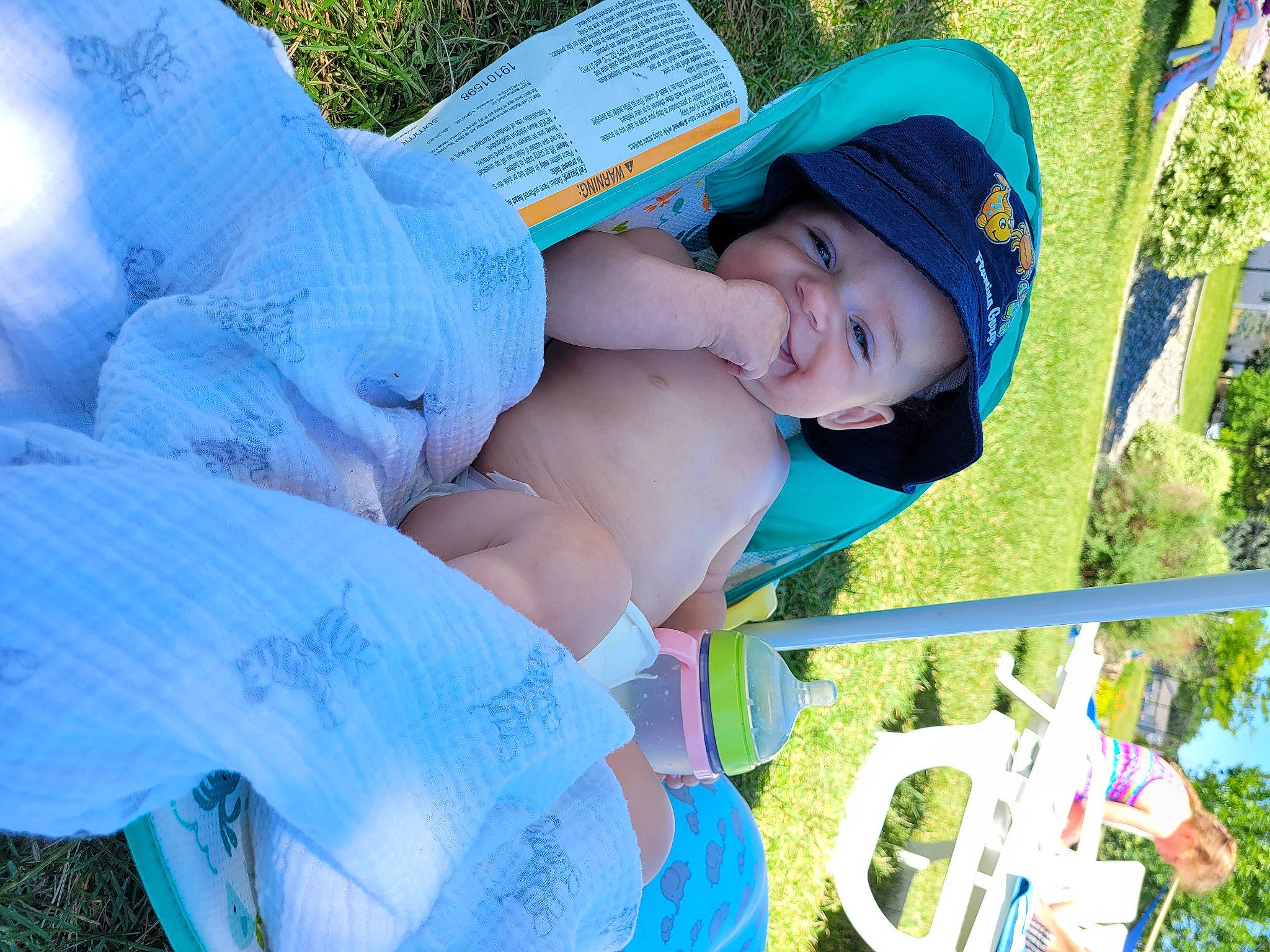 Abraham is registered to the contest to win money with this photo: azure, blue, child, electric_blue, event, fun, grass, green, happy, headgear, headwear, leisure, people_in_nature, person, photograph, plant, recreation, smile, sun_hat, toddler