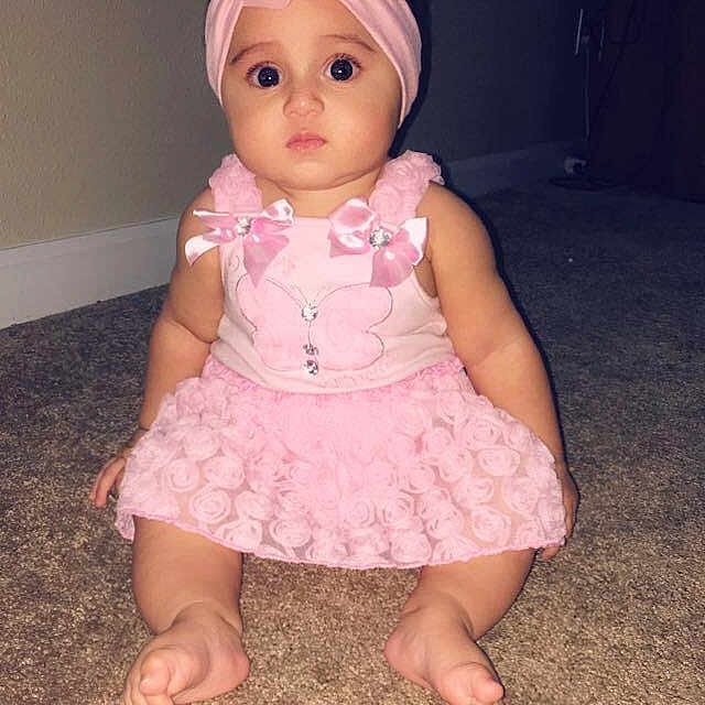 Julyza is registered to the contest to win money with this photo: baby, blond, brown_hair, cheek, child, doll, dress, fawn, head, headgear, pink, sitting, skin, smile, toddler, toy