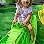 Iris participe au concours pour gagner de l'argent avec cette photo : toddler, child, playground, toy, green, crocodile, smiling, happy, outdoor, summer, dress, play, fun, sunlight, grass, feet, hands, plastic, cute, recreation