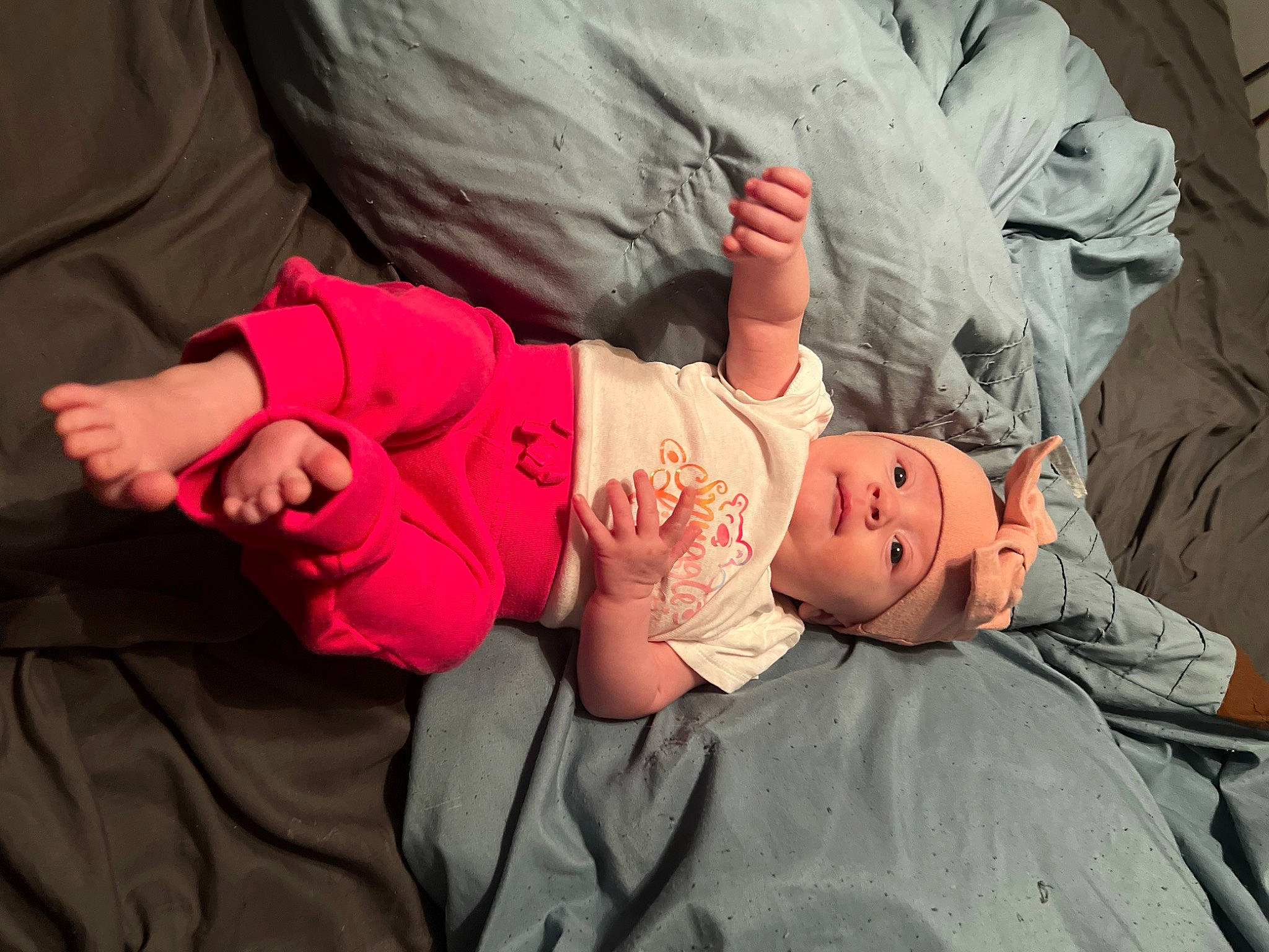 Elaine joined the competition — help win amazing prizes! baby, baby_products, baby_toddler_clothing, child, comfort, event, finger, fun, gesture, grass, hand, headwear, human_body, interaction, knee, leg, person, plant, sitting, skin